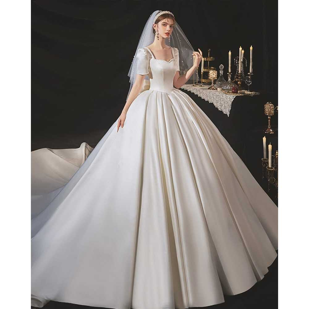 VESTIDO DE NOIVA COM MANGAS E DECOTE NAS COSTAS