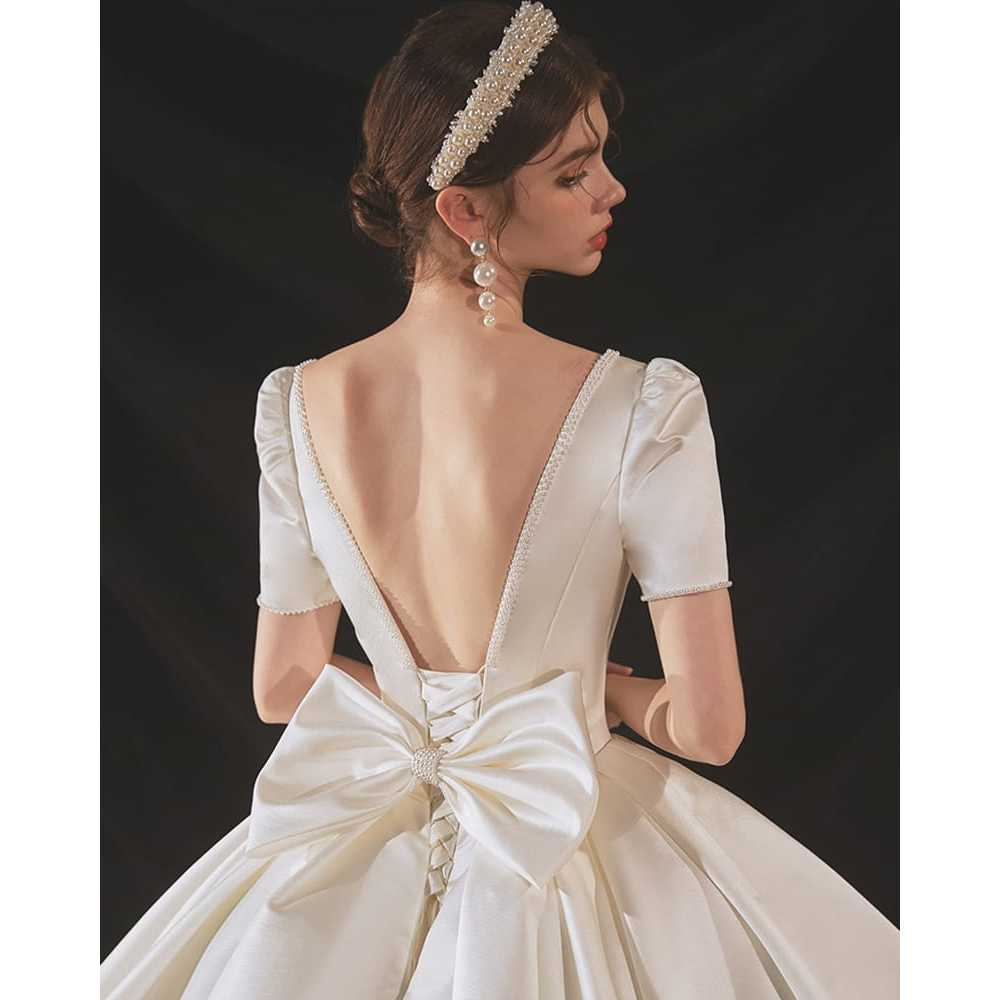 VESTIDO DE NOIVA COM MANGAS E DECOTE NAS COSTAS